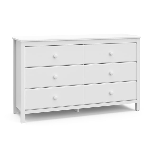 Storkcraft Alpine 6-Drawer Double Dresser in white with six spacious drawers and round knobs, crafted from wood composites with a durable laminate finish, designed for kids' rooms with a safety interlocking drawer system and anti-tip kit, shown front-facing on a white background.
