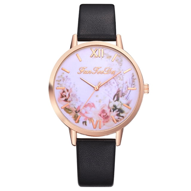 RKSTN Montres pour Femmes FanFeeDa Décontractée Mode Montre à Quartz avec Bracelet Présentant un Boîtier Rond en Alliage Or rose avec un Cadran à Motif Floral et des Marqueurs à Chiffres Romains. la Montre Présente un Affichage Analogique et un Bracelet en Cuir Noir d'Une Largeur de 1,4 cm et d'Une Longueur de 23 cm. Conçue pour les occasions Décontractées et Formelles, Cette Montre Élégante pour Femme Allie Élégance et Confort.