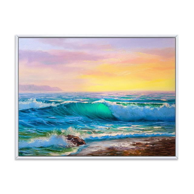 Designart Blue Waves Breaking At The Beach IV FLOAT FRAME WALL ART is a framed canvas print depicting blue ocean waves breaking near a rocky shore at sunset, printed on premium cotton canvas with fade-resistant inks and gallery-wrapped edges, arriving ready to hang and ideal for nautical-themed home décor.