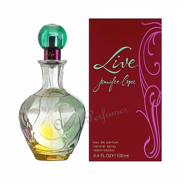 Live By Jennifer Lopez Eau De Parfum Spray 3.4 oz, featuring a clear, curvaceous glass bottle with a green and yellow gradient design, topped with a green spherical cap. The packaging includes a red box with decorative purple swirls and the 'Live' logo in green script. This women's fragrance blends notes of orange, lemon, pineapple, peony, violet, caramel, vanilla, tonka beans, and sandalwood.