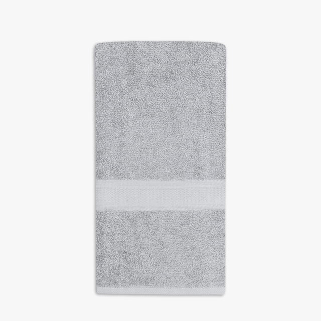 Mainstays Basics Solid Hand Towel in grey, 16 by 26 inches, made of 100% cotton with a soft, absorbent terry texture and a woven band detail, ideal for daily bathroom use and machine washable.
