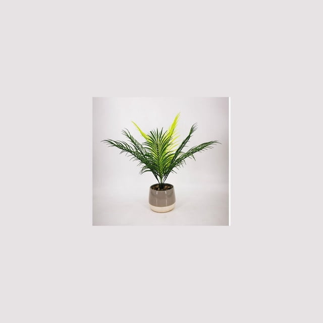 Lerman Decor's tropical potted plant with two-toned green artificial palm leaves in a taupe ceramic pot topped with polished river pebbles, centered on a white background, suitable for home or office décor and often used to add a tropical touch to indoor spaces.