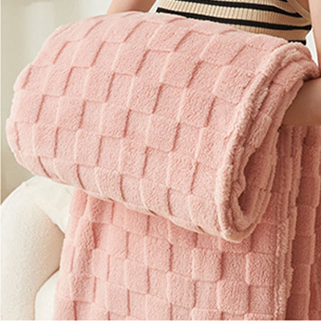 TIMIFIS Throw Blanket couch throw blanket in a thickened solid colour design with pineapple fleece texture. The coral fleece blanket is shown in a soft pink shade, featuring a checkered pattern and reversible design for added versatility. Ideal for home decor, cozy naps, or use on sofas and beds. Dimensions: 150 x 100 cm.