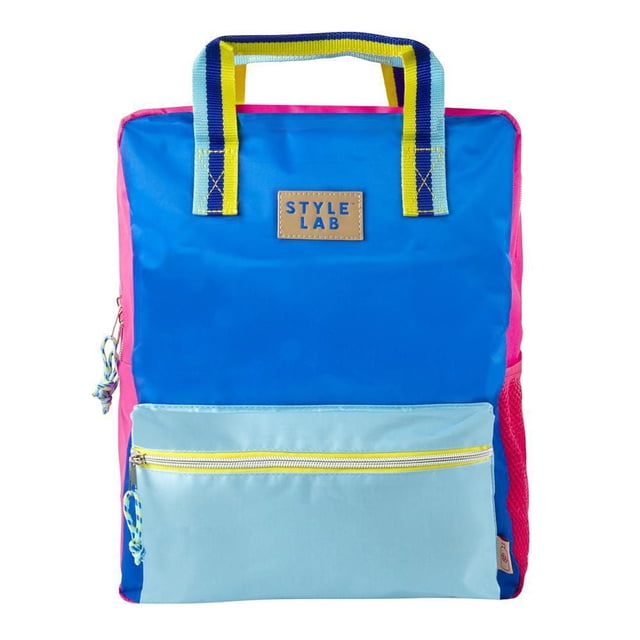 Fashion Angels Style Lab ECO-Friendly Backpack Blue & Turq with a square shape, bright blue front panel, light blue zippered pocket with yellow zipper, and pink side panels. It features dual striped handles in turquoise, yellow, and navy, a padded back panel, and adjustable straps for kids. Suitable for school and casual use, often used as a compact carry option for small tech devices.