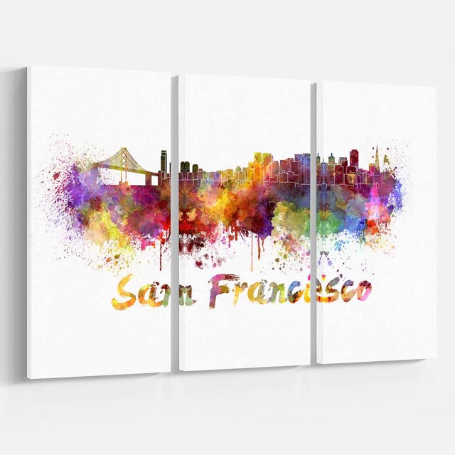 Design Art San Francisco Skyline Canvas Print featuring a three-panel gallery wrapped cotton canvas with vibrant watercolor splashes forming the San Francisco skyline including the Golden Gate Bridge, printed with high-resolution giclée ink, ready to hang with included hardware, suitable for home or office wall décor.