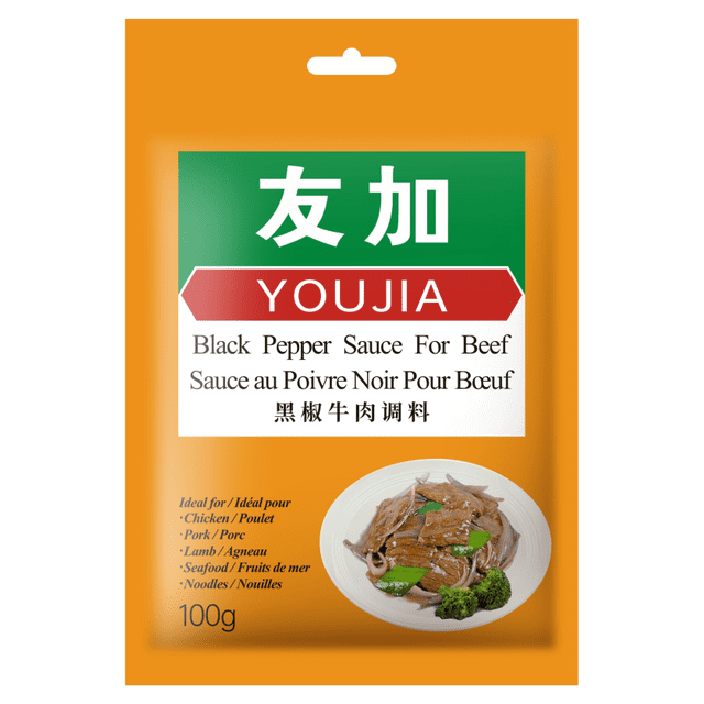 YOUJIA Black Pepper Sauce For Beef 100g in orange packaging with green and red label, featuring bilingual English, French, and Chinese text. The front shows a plate of beef stir-fry with green leaves and broccoli, ideal as a cooking sauce for chicken, pork, lamb, seafood, and noodles in Chinese cuisine.