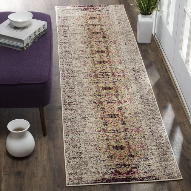 Safavieh Monaco Elsdon Abstract Area Rug runner with a power-loomed polypropylene weave, displaying a Bohemian-chic distressed abstract pattern in beige, burgundy, and olive tones, placed on dark hardwood flooring beside a purple upholstered bench and white ceramic vase near a glass door, ideal for adding vibrant texture to hallways or entryways.