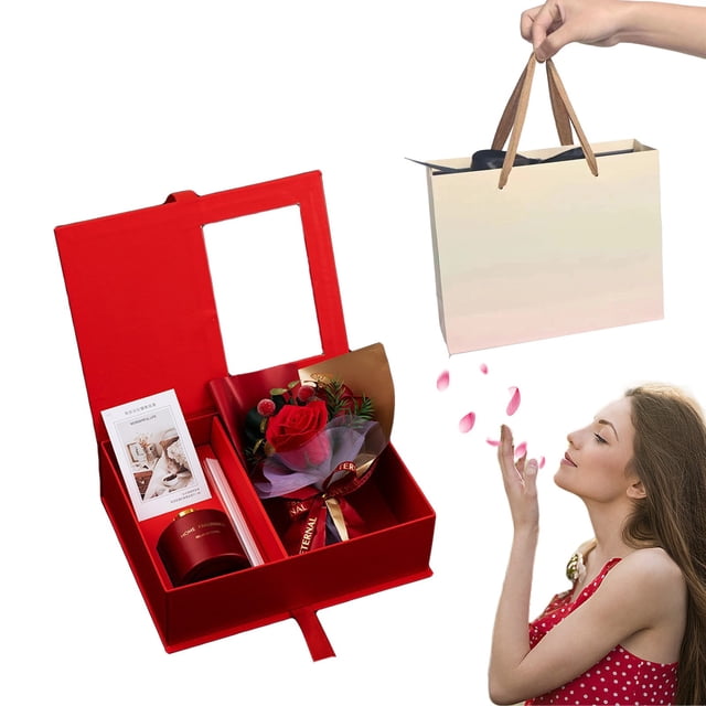Yhmxh Valentine Day Decorations Birthday Gifts For Mom Women Christmas Gifts Relaxing Spa Gift Basket. The image features a red gift box with a bouquet of artificial roses, an aromatherapy candle, and a greeting card. A beige shopping bag with brown handles is included, along with a woman in a red polka-dot dress blowing rose petals. This gift set is ideal for occasions like Valentine's Day, Christmas, or birthdays, offering a luxurious and thoughtful presentation.