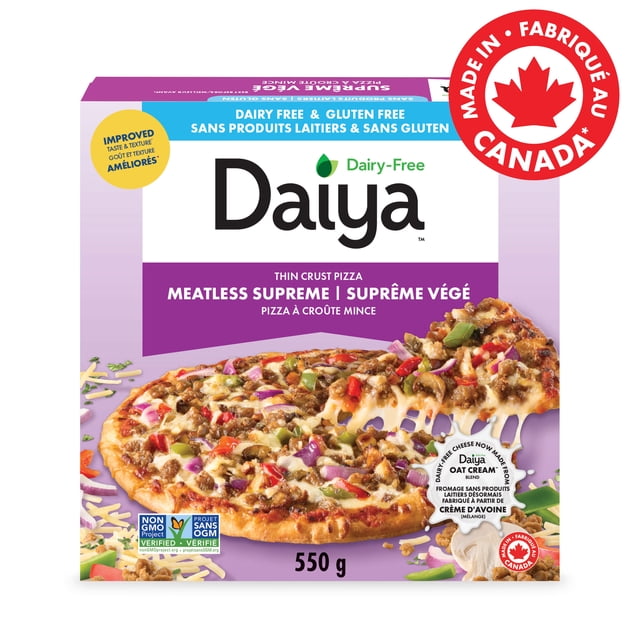 Daiya Dairy Free Gluten Free Supreme Pizza, Vegan (Frozen) with a crispy thin crust topped with Beyond Meat style meatless sausage crumbles, colorful peppers, mushrooms, onions, and melted dairy-free mozzarella cheese made from Daiya Oat Cream™ blend, shown on a purple box featuring Non-GMO Project Verified and Made in Canada labels, 550 g weight.