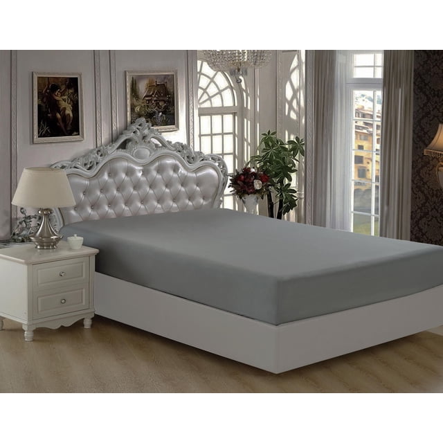 Marina Decoration Ultra Soft Silky Deep Pocket Solid Rayon from Bamboo All Season Bedding Solid Bamboo Fitted Sheet in grey fitted on a white bed frame with an ornate tufted silver headboard, in a classic bedroom with wooden floors, white nightstand with lamp, floral decor, and large arched windows.