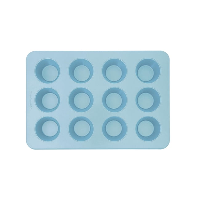KitchenAid 12-Cup Muffin Pan in Mineral Water with 12 round nonstick cups in a rectangular aluminized steel pan featuring a light blue finish, designed for even heat distribution and warp resistance, ideal for baking muffins, cupcakes, or egg bites and dishwasher safe for easy cleaning.