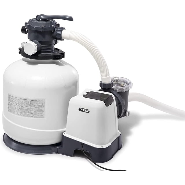 Intex Krystal Clear Sand Filter Pump, 3000 GPH, featuring a white cylindrical sand filter tank with a black multiport valve, connected to a white and black pump housing with the Intex logo, flexible white hoses, and a clear strainer basket, designed for above ground pool filtration with a 6-function control valve and built-in 24-hour timer for hassle-free maintenance.