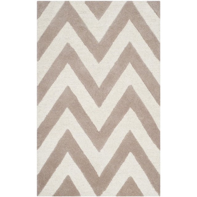 Safavieh Cambridge Kaitlyn Zig Zag Stripes Area Rug with beige and off-white zigzag stripes, hand-tufted wool construction combining plush cut piles and textured high/low loop and cut piles, suitable for home or office accent decor.