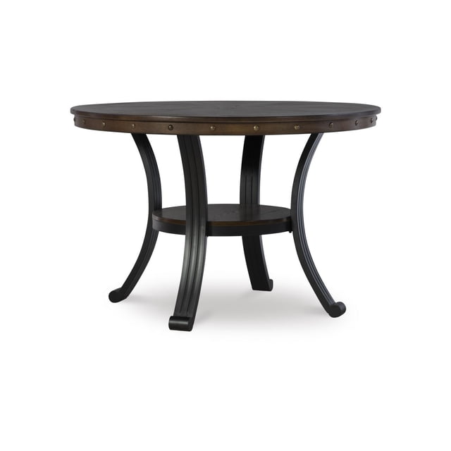 Trager Dining Table with a 45-inch round umber brown oak woodgrain veneer top featuring antique bronze nailhead accents on the apron, supported by a matte black metal base with curved legs and a small circular shelf, ideal for kitchen or formal dining rooms.