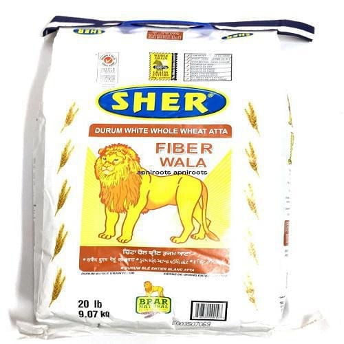 Sher Whole Wheat White Flour 20 lb bag featuring a yellow lion illustration and labeled Fiber Wala Durum White Whole Wheat Atta, a high-fiber, nutrient-rich Indian flour ideal for making rotis, with wheat stalk graphics on white packaging.