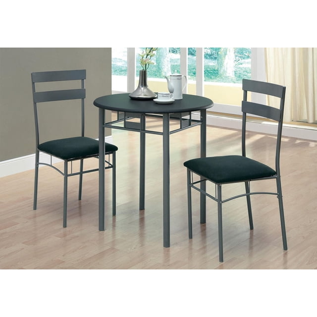 Monarch Specialties Dining Table Set, 3pcs Set, Small, 30" Round, Kitchen, Metal, Laminate, Black, Grey, Contemporary, Modern with a round black PVC laminate tabletop supported by charcoal grey steel tube legs, paired with two armless metal chairs featuring horizontal slat backs and black microfiber cushioned seats, suitable for small kitchens or breakfast nooks, set on light wood flooring near a window with natural light.