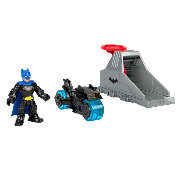 Imaginext DC Super Friends Launcher Set with 3-inch Batman action figure in black and blue costume, a black and blue motorcycle with translucent blue wheels and Batman logo, and a gray launcher housing unit with red power pad for action figure vehicle playsets.