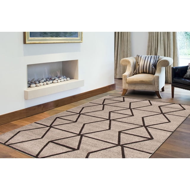 ECARPET Living Room Bedroom Carpet, Geometric Indoor Area Rug Ana Collection in grey with dark geometric diamond patterns, placed on hardwood floor in a living room with a beige armchair and built-in fireplace, often used to enhance texture and style in indoor areas.