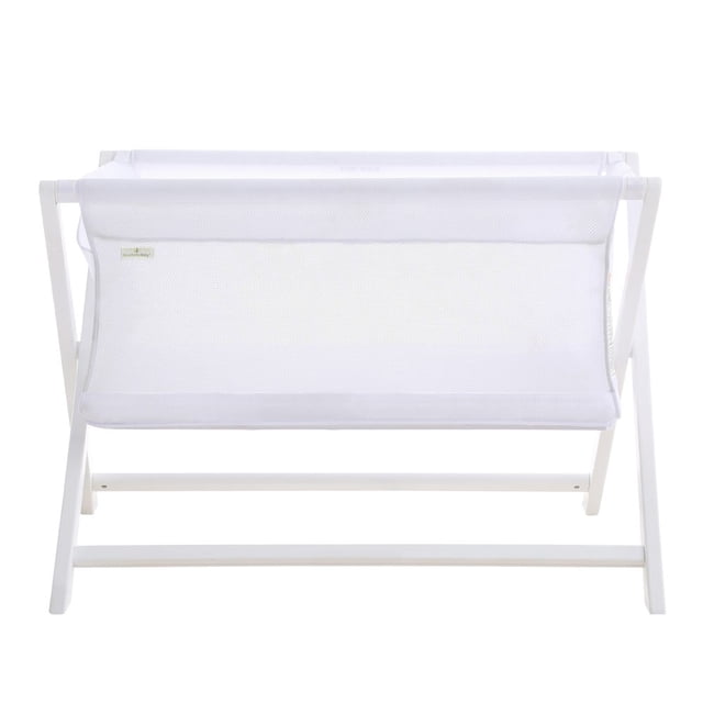 BreathableBaby Breathable Mesh Portable Bassinet in white, featuring a lightweight and foldable design with patented breathable mesh sides for maximum airflow. The bassinet is cradle-sized, offering over 30% more sleep space than typical bassinets, and includes a 1-inch waterproof mattress. Made from eco-friendly New Zealand pine and composite materials, it is Greenguard Gold certified and free of harmful chemicals. Ideal for newborns up to 6 months or 18 lbs, this portable bassinet is perfect for room sharing or travel.