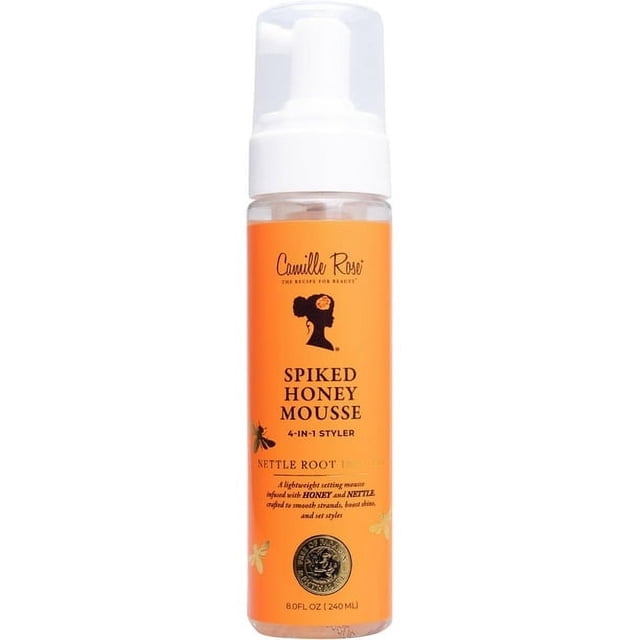 HONEY MOUSSE in a clear bottle with an orange label and white foam pump, labeled Camille Rose Spiked Honey Mousse 4-in-1 styler with nettle root and honey, designed for hair styling, conditioning, and curl definition, 8 fl oz (240 ml). Suitable for all hair textures and protective styles.
