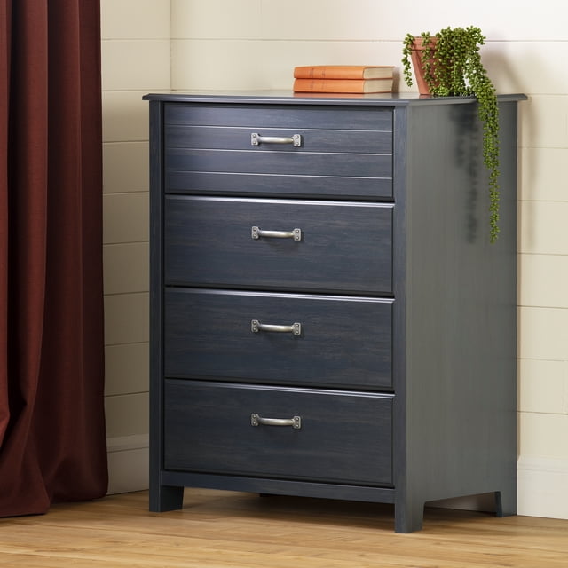 South Shore Asten 4-Drawer Chest for Child in Blueberry with four large drawers featuring metal handles and slides for quiet use, classic straight lines, and a smooth blueberry finish, standing on a wooden floor against a white paneled wall, topped with three orange books and a trailing potted plant, suitable for organizing kids' clothes and accessories in compact bedrooms.