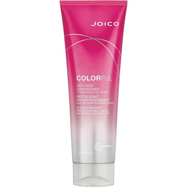 JOICO COLORFUL ANTI-FADE CONDITIONER in a pink to silver gradient tube with white text, formulated to protect color-treated hair with UV protection, reduce breakage, and provide lightweight hydration for long-lasting vibrancy and shine.