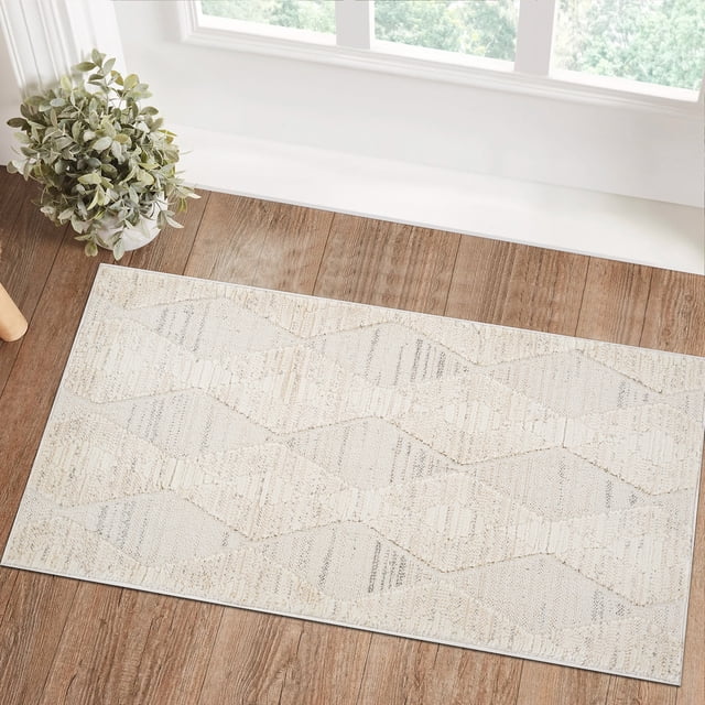 Modern cream beige indoor area rug with abstract diamond pattern placed on wood flooring by a window and potted plant.