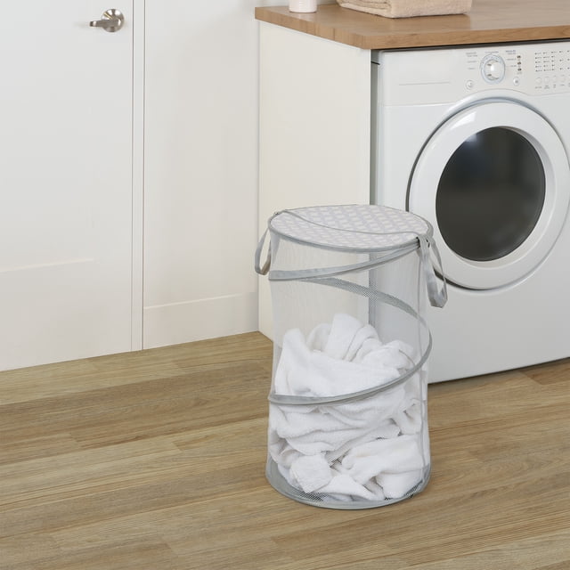 Neatfreak Pop-Up Laundry Hamper collapsible mesh laundry hamper, lidded to keep items contained with easy-access slit opening, fabric carrying handles and ventilated airflow mesh sides; holds two full loads. Measures 16 in W x 16 in D x 24.8 in H (40.6 x 40.6 x 63 cm). Often used to store toys in dorms or small apartments.