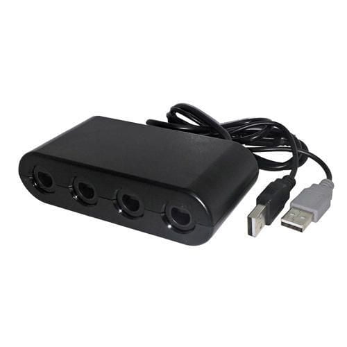 TTX Tech GameCube Compatible Controller Adapter for the Nintendo Wii U with a matte black rectangular body featuring four controller ports and a cable with two USB connectors, enabling plug-and-play connection of original and third-party GameCube controllers for multiplayer gaming on the Wii U console.