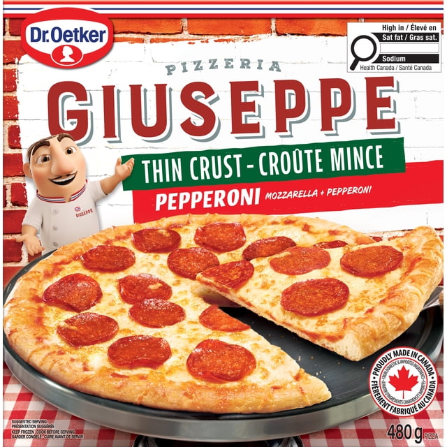 Dr. Oetker Giuseppe Pizzeria Thin Crust Pepperoni Pizza showing a round thin crust pizza topped with melted mozzarella cheese and pepperoni slices on a black pizza tray over a red and white checkered tablecloth, with packaging branding and Canadian origin label visible.