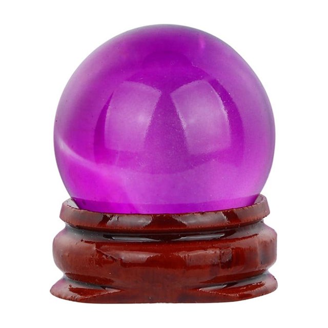HOT! 30mm Natural Quartz Magic Crystal Ball Healing Ball Sphere and Stand featuring a vibrant purple quartz sphere resting on a polished wooden base. The 30mm crystal ball reflects objects with a transparent, dreamlike quality, making it a striking decorative object for home décor. Described as bringing luck and driving away sadness, it is ideal for tables or shelves and a versatile gift option.