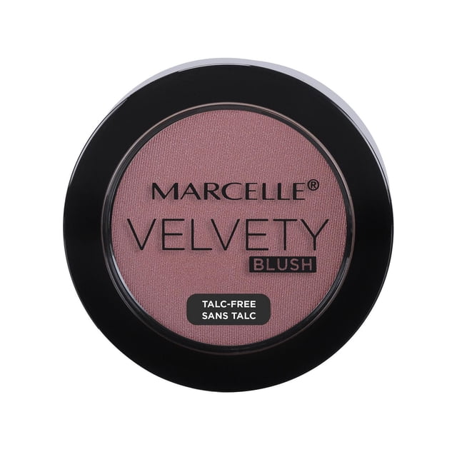 Marcelle Velvety Blush in a round black compact with a clear lid showing soft pink powder, talc-free with superfine pigments and vitamin E for smooth, natural cheek color and easy blending in makeup application.