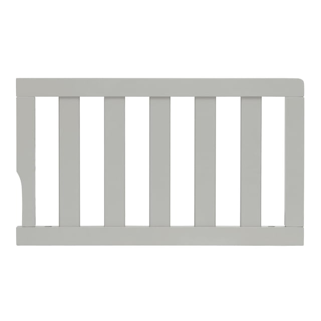 Dream On Me Universal Convertible Crib Toddler Guard Rail in light grey solid wood with vertical slats and rectangular frame, designed to convert compatible cribs into toddler beds, providing safety by preventing falls during toddler bed transition.