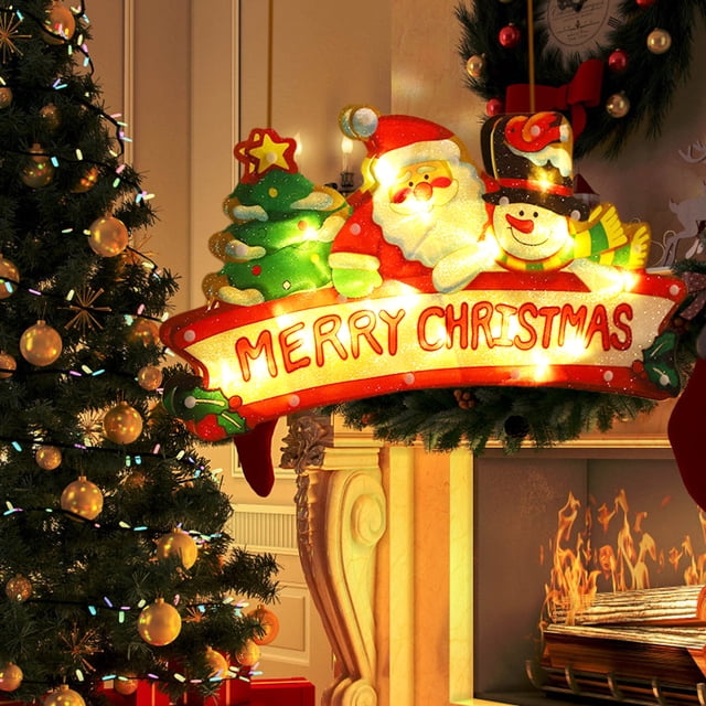 UsRHHA Christmas Window Lights, Hanging Decorative Lights with Battery Power, showcasing a festive design with Santa Claus, a snowman, and a Christmas tree illuminated by warm LED lights. The sign reads 'Merry Christmas' and is ideal for decorating windows, doors, or mantels. Displayed in a cozy holiday setting with a decorated Christmas tree, fireplace, and wreath in the background.