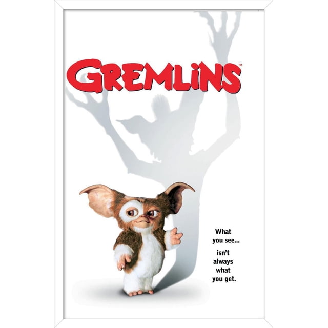Gremlins - One Sheet Wall Poster, 22.375" x 34" depicting a small furry creature with large ears standing against a white background casting a shadow of a larger clawed figure, with the text 'What you see... isn't always what you get.' This poster is ideal for adding bold wall décor to bedrooms, offices, or dorms.
