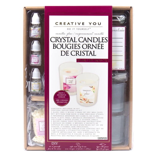 Creative You D.I.Y. Vanilla Glow Crystal Candles kit includes two glass jars, wicks, soy wax chips, fragrance droppers, semi-precious stones, dried peach blossoms, gift tags, thread, wooden sticks, and recipe cards to create two botanical scented candles with vanilla and rose fragrances.