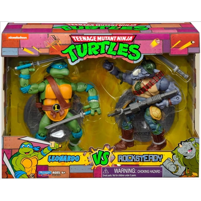 Teenage Mutant Ninja Turtles 6 Inch Action Figure Original TV 2-Pack - Leonardo vs Rocksteady front-facing studio shot of two 6-inch poseable figures: Leonardo in a blue mask wielding twin katanas and green shell, and Rocksteady as a gray rhinoceros humanoid in camo pants holding a large weapon accessory; figures shown with TMNT window box packaging visible behind them, suitable for display or diorama use.