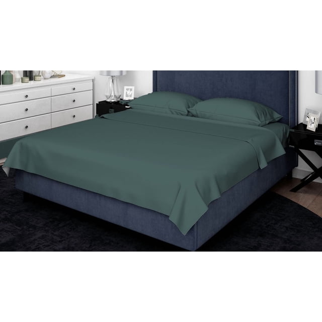 Johnson Home 500 Thread Count Certified Organic Cotton Sheet Sets in dark teal on a navy blue upholstered bed with a tall headboard, including two pillowcases and a flat sheet, shown in a contemporary bedroom with white dresser and black nightstands, offering breathable, hypoallergenic comfort ideal for year-round use.