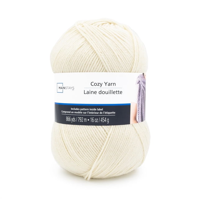 Mainstays Cozy Medium Acrylic Yarn 1 Ball in off-white, 16 oz (454 g) with 792 m (866 yds) length, shown front-facing with a bilingual white and blue label featuring a knitting pattern, suitable for machine washable crafting projects including afghans and accessories.