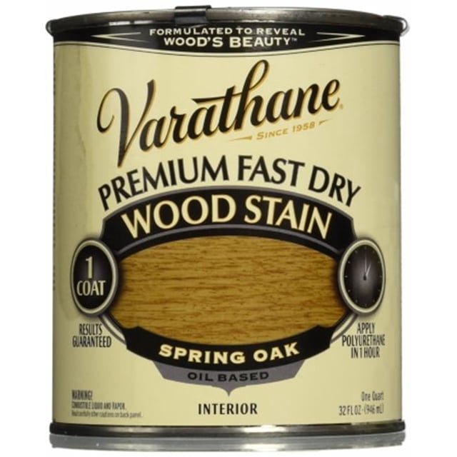 Varathane 262004 1 Quart Spring Oak Fast Dry Wood Stain, featuring a premium oil-based formula for interior wood surfaces. The can displays the Spring Oak shade with a fast-drying, one-coat application promise. Packaged in a 1-quart container, it is designed to enhance wood's natural beauty.
