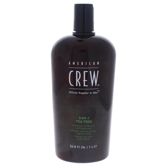 3-In-1 Tea Tree Shampoo, Conditioner, and Body Wash by American Crew for Men, 33.8 oz bottle. A dark brown bottle with green and white text, designed for cleansing and conditioning hair and skin. Suitable for everyday use, travel, gym, or as part of travel size toiletries.