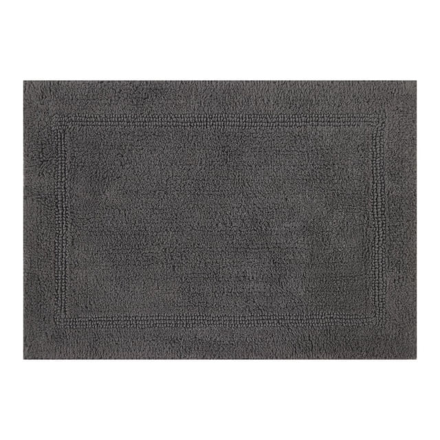 Better Homes & Gardens Cotton Reversible Bath Rug in grey flannel, 17" x 24", made of 100% cotton with a soft, absorbent texture and subtle rectangular border, machine washable and ideal for bathroom use.