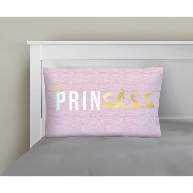 Mainstays Kids Printed Pillowcase in pink polyester microfiber with 'PRINSASS' printed in white and gold letters and a gold star above the 'P', displayed on a white bed frame with gray bedding, ideal for adding playful style to kids' bedding.