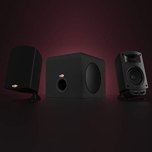 Klipsch ProMedia 2.1 THX Certified Computer Speaker System in black, featuring two satellite speakers and a subwoofer. The compact three-piece setup delivers high-quality sound suitable for music, movies, TV, and gaming. The subwoofer has a front-facing port and textured finish, while the satellite speakers have angled stands for optimal sound projection. Displayed against a dark gradient background.