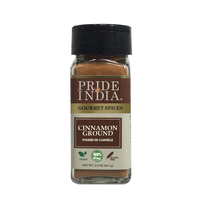 Pride of India Natural Cinnamon Ground in a 2 oz. small dual sifter bottle. This Indian spice is 100% natural, vegan, and gluten-free, perfect for sweet and savory dishes. The bottle features a brown and gold label with clear branding and product details, suitable for baking, beverages, and curries.