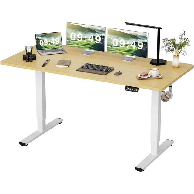 Toytexx Electric Standing Desk 63"x24", a modern home office desk with a natural wood top and white steel frame. Features a spacious 63"x24" engineered wood surface, perfect for dual monitors and work essentials. Includes an electric height adjustment mechanism (28.75" to 48"), a digital control panel with memory presets, and a headphone hook. Suitable for home offices, workstations, and creative spaces.