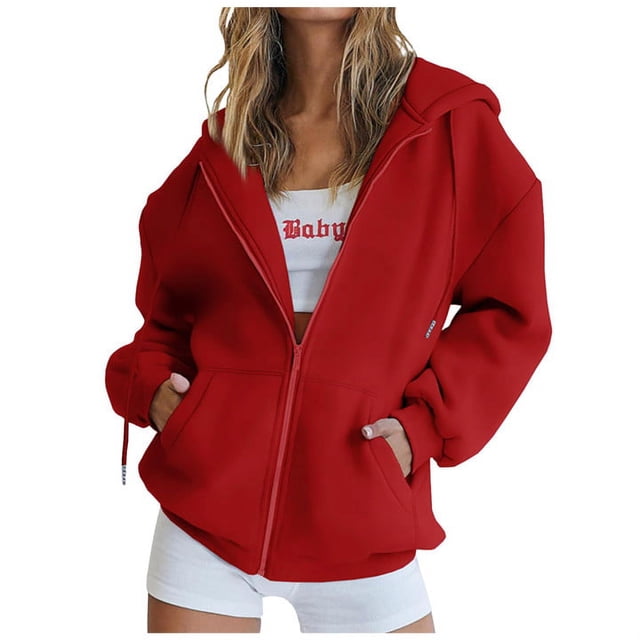 RKSTN Womens Zip Up Y2K Hoodies Long Sleeve Fall Oversized Casual Solid Color Sweatshirts Jacket with Pockets. The image shows a red oversized zip-up hoodie with a hood, long sleeves, and kangaroo pockets. The hoodie is styled with a white crop top and white shorts, suitable for casual wear in fall or winter.