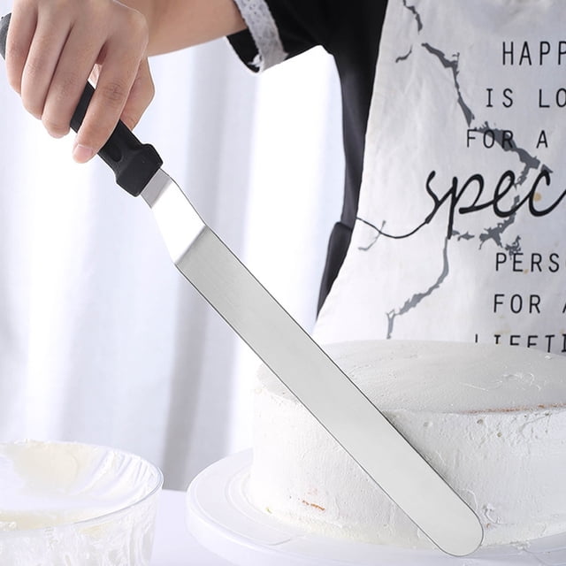 YAOMOBB Kitchen Accessories Icing Spatula Set with three stainless steel offset spatulas designed for precise frosting and baking tasks. The image shows one spatula in use, frosting a white cake with smooth, crumb-free layers. Features include ergonomic handles with thumb rests for comfort, dishwasher-safe material, and versatile use for spreading batter, making sandwiches, and more.