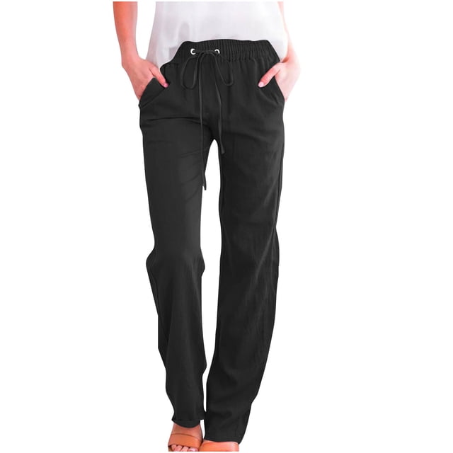 Timegard Womens Cotton Linen Pants featuring an elastic waistband with a drawstring, straight-leg design, and solid black color. These casual pants are crafted for comfort and style, made from a breathable and lightweight fabric blend of 95% polyester and 5% spandex. The pants include side pockets and are suitable for lounging or casual outings. Shown in a front-facing view paired with a white top and orange sandals.