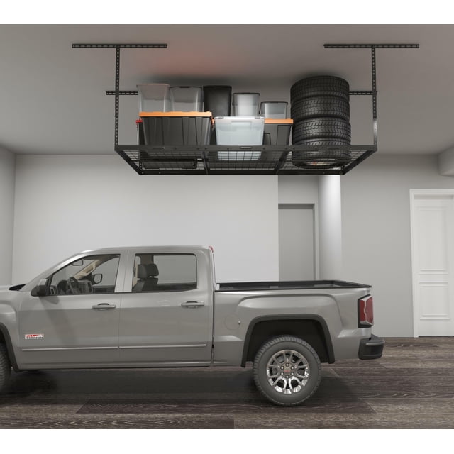 3x6ft overhead garage storage shelves in black, featuring a heavy-duty metal construction with adjustable drop-down height from 22 to 40 inches. The ceiling-mounted storage rack measures 72 inches in length, 36 inches in width, and 40 inches in height, with a weight capacity of 450 lbs. The image shows the rack installed in a garage, holding various items such as storage bins and tires, maximizing space above a parked truck.